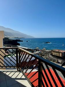 a view of the ocean from a balcony at Mangos Mar E in Puerto Naos