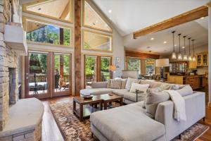 a living room with two couches and a fireplace at Mountain Luxury, Sleeps 10, Private Hot Tub, 15 Min to Canyons, Ideal for Family Getaways! in Park City