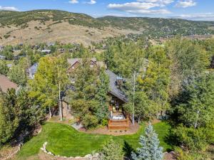 an aerial view of a house with a yard at Mountain Luxury, Sleeps 10, Private Hot Tub, 15 Min to Canyons, Ideal for Family Getaways! in Park City
