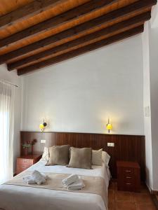 Postel nebo postele na pokoji v ubytování Hostal Camarina