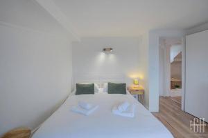 Postel nebo postele na pokoji v ubytování Le Bleuet - Quartier Des Halles