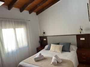 Postel nebo postele na pokoji v ubytování Hostal Camarina
