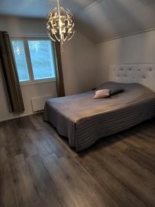 Giường trong phòng chung tại Villa Valentina Ähtäri