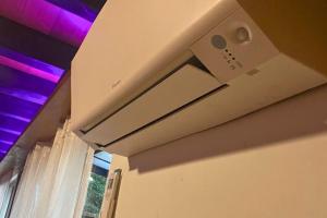 a ceiling with purple lights in a room at Haus Löwe - Komplettes Ferienhaus am Badesee in Erzgrube +33 photos