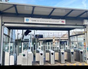a bunch of parking meters in front of a station at Auxilia Home in Beauchamp