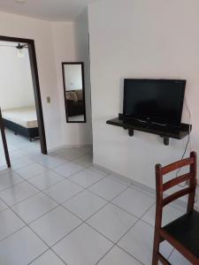 TV a/nebo společenská místnost v ubytování Apartamento Simples