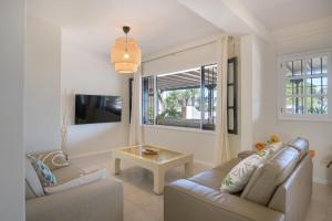 TV a/nebo společenská místnost v ubytování Casa Maresia, Playa Bastian