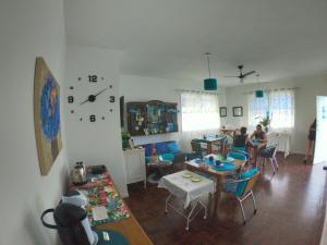 a living room with a group of people in it at A Primeira Vista in Florianópolis +38 photos