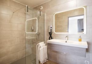 Koupelna v ubytování Hotel Tambourin