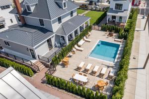 an aerial view of a house with a swimming pool at The Hen Houses in Wildwood