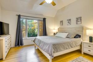 a bedroom with a bed and a window at 2 Mi to Winnipesaukee Shores Gunstock Retreat in Gilford +26 photos