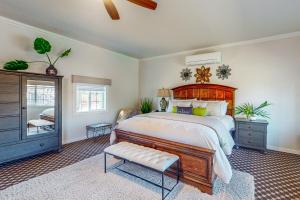 a bedroom with a large bed with a wooden headboard at Guglielmo Winery Casetta in Morgan Hill