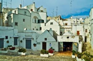 a group of white buildings in a city at Archetto Bianco in Martina Franca