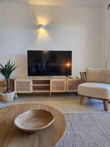 TV a/nebo společenská místnost v ubytování Beach-Cottage + 8 fotografií