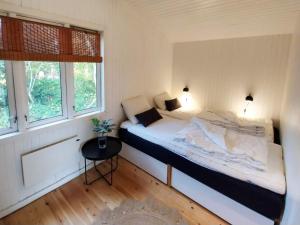 Postel nebo postele na pokoji v ubytování 6 person holiday home in Jægerspris-By Traum