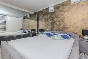 Ένα ή περισσότερα κρεβάτια σε δωμάτιο στο Apartments Mavracic