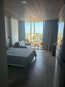 Ένα ή περισσότερα κρεβάτια σε δωμάτιο στο Studio 520 no NEW TIME, Pajuçara +25 φωτογραφίες