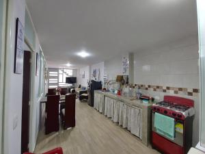 a kitchen with a stove and a counter top at Apto Vacacional Denis T in Tunja