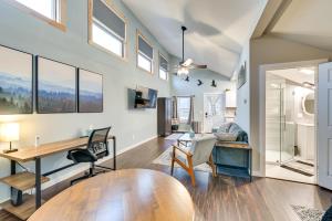 an open living room with a table and chairs at Old Forge Studio: Close to Lakes & Hiking Trails in Old Forge