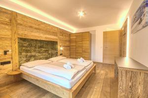 Posteľ alebo postele v izbe v ubytovaní Alpin & Seeresort Top 14 - by Alpen Apartments