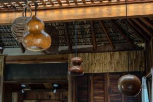 a room with various objects hanging from the ceiling at Casa cerro in Puerto Escondido