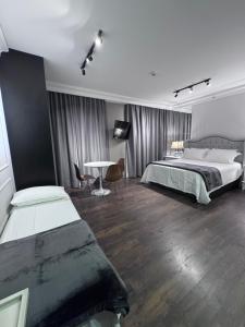Letto o letti in una camera di Flat Higienópolis Com Varanda