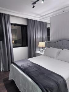 Letto o letti in una camera di Flat Higienópolis Com Varanda