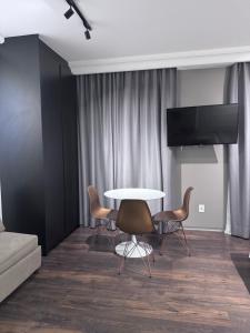 TV o dispositivi per l'intrattenimento presso Flat Higienópolis Com Varanda