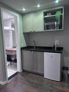 Cucina o angolo cottura di Flat Higienópolis Com Varanda