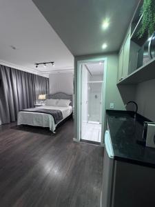 Letto o letti in una camera di Flat Higienópolis Com Varanda