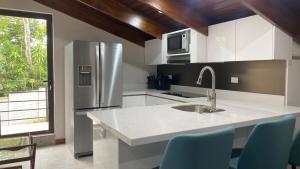 Kuchyň nebo kuchyňský kout v ubytování Casa Marigold -Apartamento Bondad