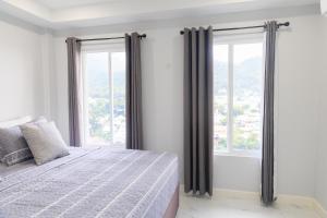 Postelja oz. postelje v sobi nastanitve Caldera Villas