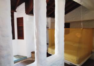 a view through a glass window of a room at Posada Las Tortuguitas in Mazunte
