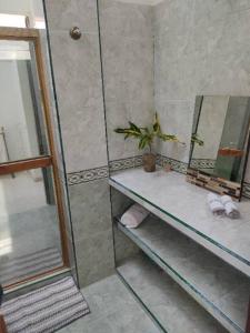 a bathroom with a sink and a mirror at Quinta Xcaret in Cabudare +37 photos