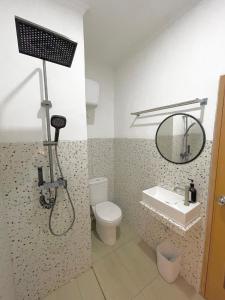 a bathroom with a shower and a toilet and a sink at Kataleya Villa, Punclut 4BR in Bongkar 2 +19 photos