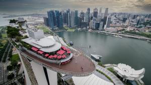 an aerial view of a city with a body of water at Marina Bay Sands in Singapore
