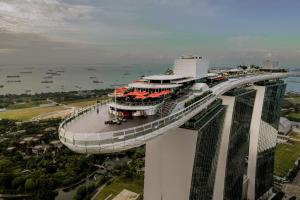 an elevated view of a building with a bridge at Marina Bay Sands in Singapore