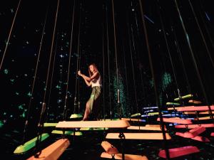 a woman standing on top of a table at Marina Bay Sands in Singapore