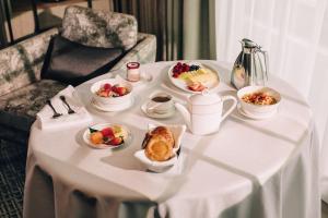 a table with plates of breakfast foods on it at Marina Bay Sands in Singapore