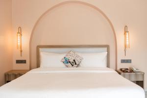 Girisadan Boutique Stay客房内的一张或多张床位