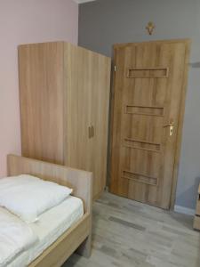 Postel nebo postele na pokoji v ubytování Dom Brama Mazur
