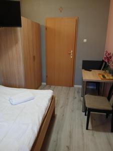 Postel nebo postele na pokoji v ubytování Dom Brama Mazur