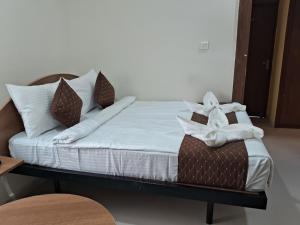 Letto o letti in una camera di SM Residency