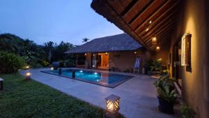 a house with a swimming pool in the yard at IVY VILLA in Mahabalipuram