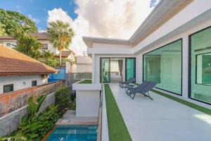 an image of a house with a swimming pool at Peaceful Paradise in Saiyuan Villa V147 in Ban Saiyuan (1)