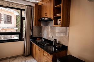 A cozinha ou kitchenette de Sinpa Home Pilachhen