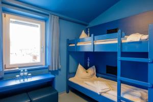 Ein Bett oder Betten in einem Zimmer der Unterkunft Jugendherberge Oberammergau