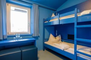 Ein Bett oder Betten in einem Zimmer der Unterkunft Jugendherberge Oberammergau