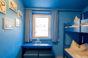 Ein Bett oder Betten in einem Zimmer der Unterkunft Jugendherberge Oberammergau
