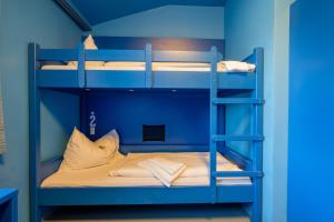 Ein Bett oder Betten in einem Zimmer der Unterkunft Jugendherberge Oberammergau